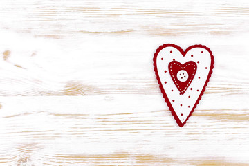 Valentine's Day. wooden heart on a white wooden background