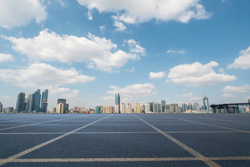 Empty asphalt road along modern commercial buildings in China,s cities