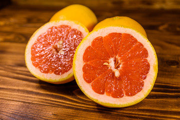 Ripe juicy grapefruit on a wooden table