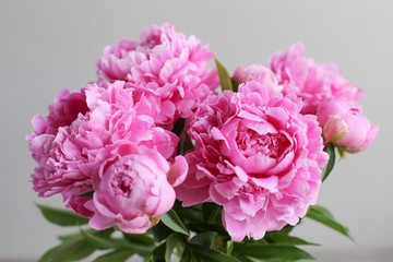 Flowers composition.  Pink peony flowers on wooden background. Mothers day. Flat lay, top view.