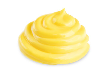 Drop of yellow cheese sauce on a white background