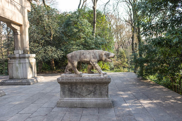 Stone dragon statue protecting a garden