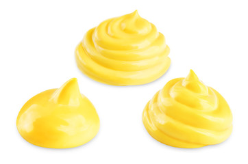 Drop of yellow cheese sauce on a white background