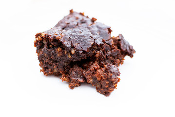 Close up of a vegan chocolate brownie with nuts