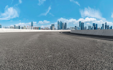 Empty asphalt road along modern commercial buildings in China,s cities