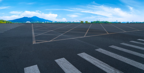 Empty asphalt road square and natural landscape under the blue sky