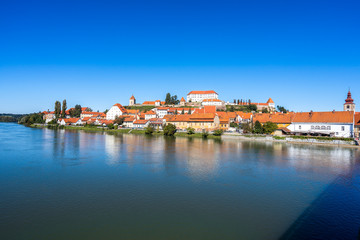 A view of the center of city of Ptuj, church, castle and old historical town of Ptuj, Slovenia. Blue sky, summer day in wine area of Ptuj, Ormoz and Jeruzalem.