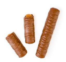 The chocolate stick and two halves on a white. The form of the top.