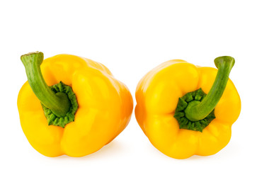 Two bell peppers yellow close-up on a white. Isolated.