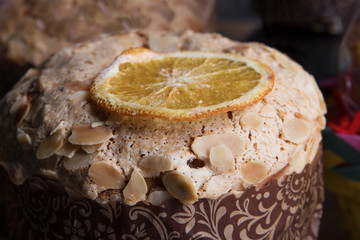 Close - up of home Easter cake with nuts decorated with a slice of orange