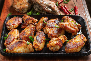 Chicken wings on barbecue grill. Tasty, beautiful and appetizing.
