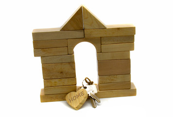 House made of building blocks with heart and door key