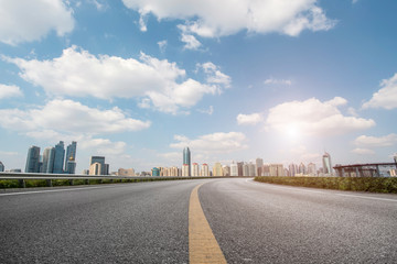 Fototapeta premium Empty asphalt road along modern commercial buildings in China,s cities