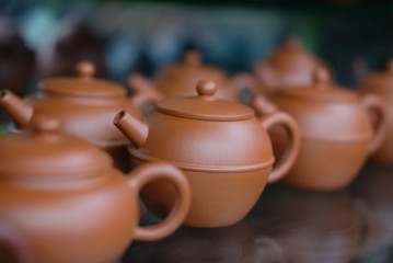 Chinese brown clay pot in shop closeup photo