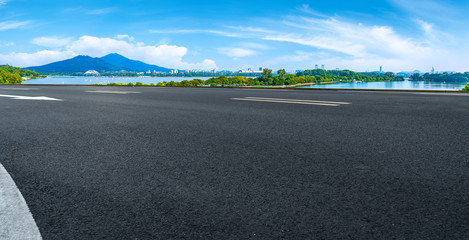 Empty asphalt road square and natural landscape under the blue sky