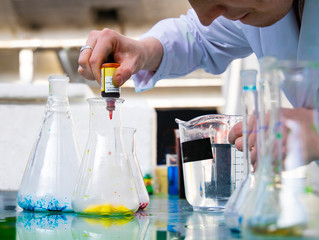 Laboratory worker pipette color smoke