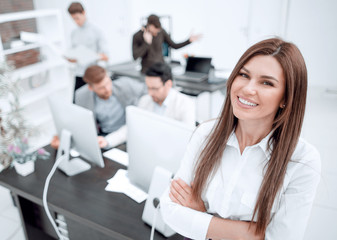 smiling businesswoman standing in a modern office