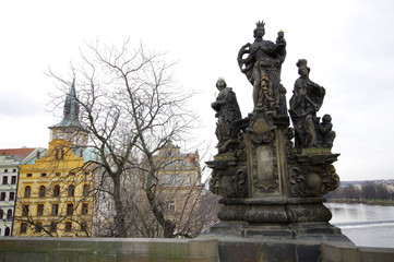 Fototapeta na wymiar Statue of St. Barbara, St. Elizabeth and St. Margaret on Charles bridge, Prague, Czech Republic