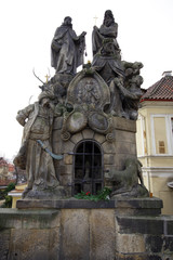 Fototapeta na wymiar Statues of Saints John of Matha, Felix of Valois, and Ivan on Charles bridge, Prague, Czech Republic