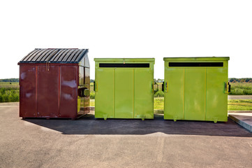 Brown garbage container and green recycling containers in a commercial parking. Isolated on white background.