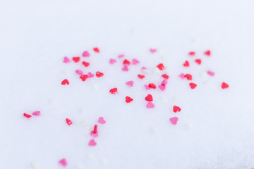 Red felt valentine hearts on the snow white background. Valentine's day concept