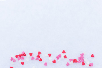 Red felt valentine hearts on the snow white background. Valentine's day concept