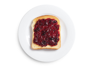 Toast with cranberry jam on white plate