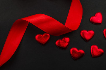 Red rose and Valentines day hearts on wood. Top view with copy space