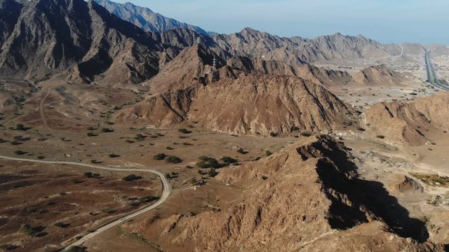 AERIAL. Top view of Road between mountains in UAE