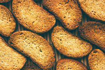 Delicious dried mustard bread. Bread slices on bamboo mats.