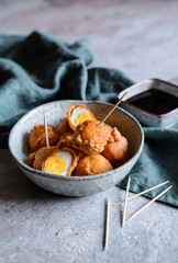 Kwek Kwek - deep fried quail eggs coated with batter served with soya sauce and vinegar dip