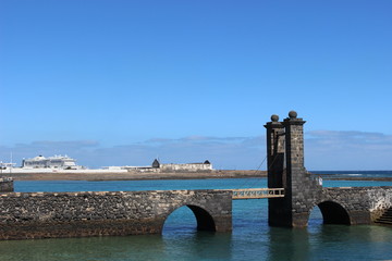 old bridge in front of the sea