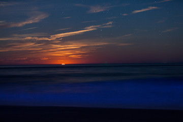 Red Moonrise above the sea at twlight