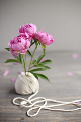 Obraz premium Floral frame with pink peonies on wooden background. Mothers day.