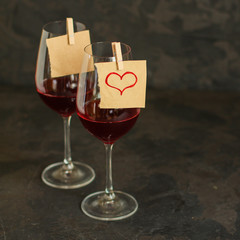 red wine in a transparent glass (dark background). copy space