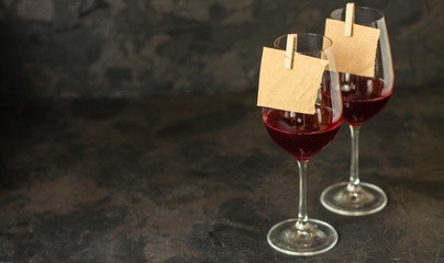 red wine in a transparent glass (dark background). copy space
