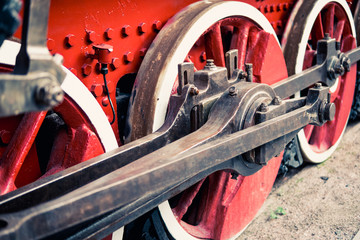 color image of the details of the old Steam locomotive with cranks and wheels