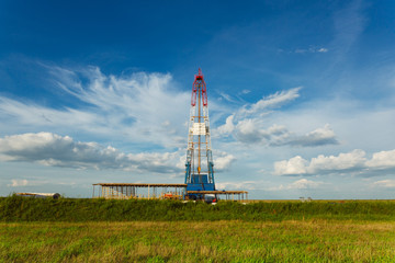 Fototapeta na wymiar Drilling rig in oil field for drilled into subsurface in order to produced crude. Petroleum Industry