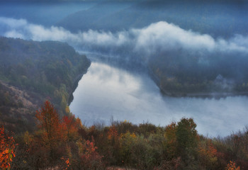 fog over the canyon of the picturesque river. autumn morning in national park