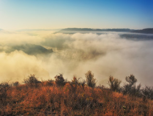 fog over the canyon of the picturesque river. autumn morning in national park