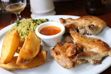 fried chicken with potatoes and sauce