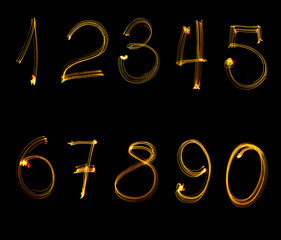 fire numbers, from 0 to 9, on a black background.