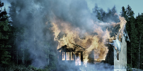 Panorama view of burning wooden house.