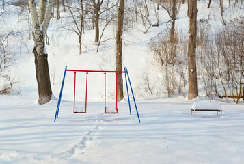City square is still under snow but bright sun is signaling about spring approach. Winter or early spring background.