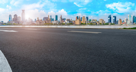Naklejka premium Empty asphalt road along modern commercial buildings in China,s cities