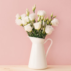 White roses in vintage vase