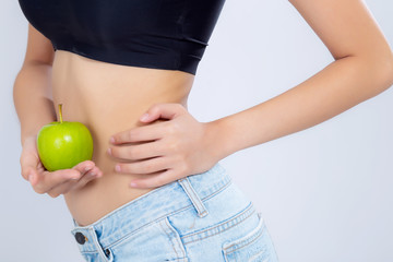 beautiful body woman sexy slim holding green apple with cellulite for wellness, girl waist thin with fitness for weight loss and healthy isolated on white background, healthcare and diet concept.