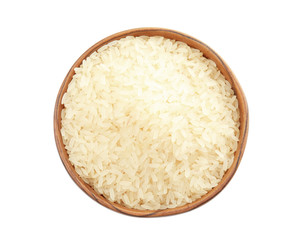 Bowl with uncooked rice on white background, top view