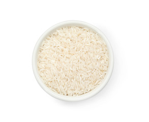 Bowl with uncooked rice on white background, top view