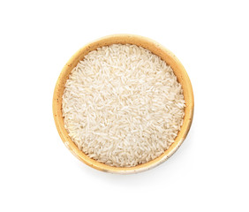 Bowl with uncooked rice on white background, top view